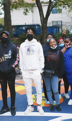 21 Savage wearing Fear of God pants