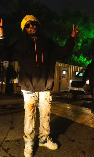 Wale wearing Who Decides War jeans