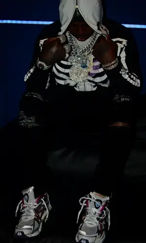 EST Gee wearing Amiri jeans