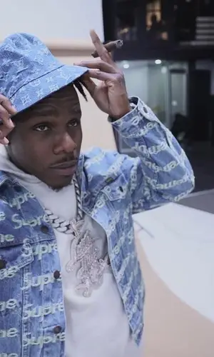 DaBaby wearing Louis Vuitton boots