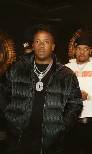 Yo Gotti wearing Amiri jeans