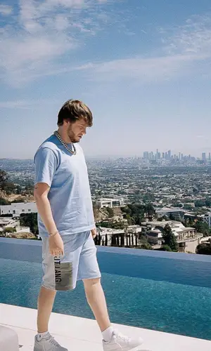 Murda Beatz wearing Helmut Lang shorts