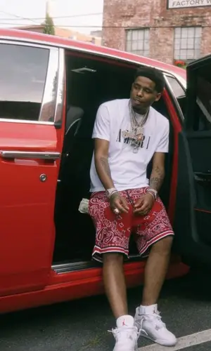 Pooh Shiesty’s Outfit in Amiri T-Shirt & Jordan Sneakers (2021)
