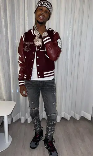 Toosii wearing Ruggero Clothing jacket