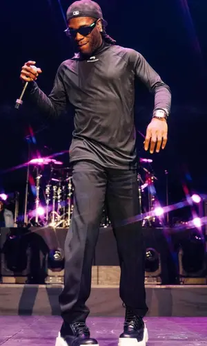 Burna Boy wearing New Era cap