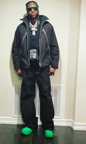 2 Chainz wearing Balenciaga bag