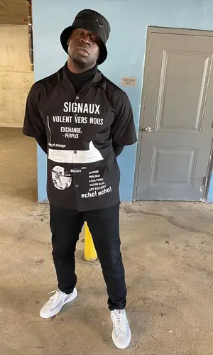 G4 Boyz Buggy wearing Prada shirt