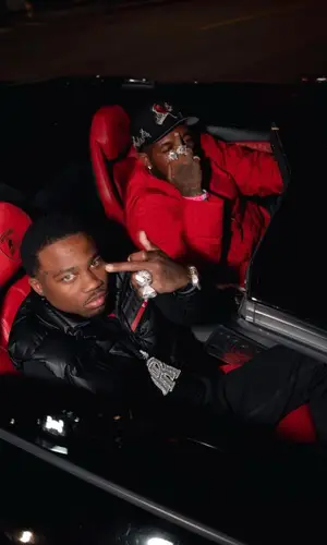 Roddy Ricch wearing Prada sweater