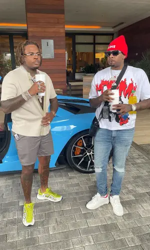 Lil Duke’s Outfit in Off-White Sneakers, Louis Vuitton Bag & Celine Hat (2021)