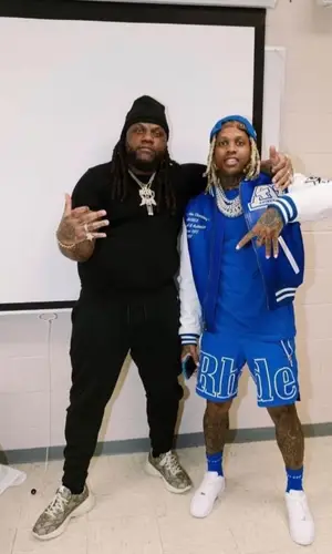 Lil Durk wearing Rhude shorts