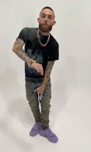Gutta100 wearing Purple Brand jeans