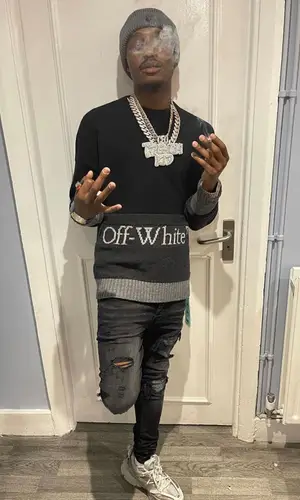 Lil Tjay wearing Off-White hat