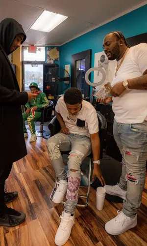Peezy wearing Amiri jeans