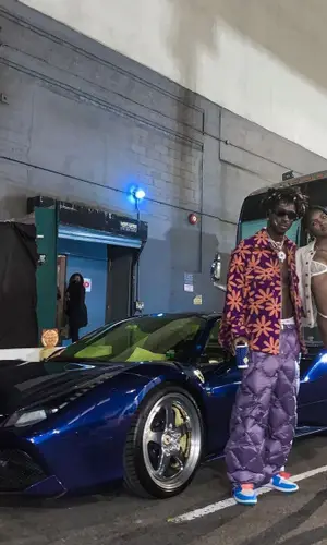 Saint JHN’s Outfit in Jacquemus Jacket, Miu Miu Pants & Balenciaga Eyewear (2021)