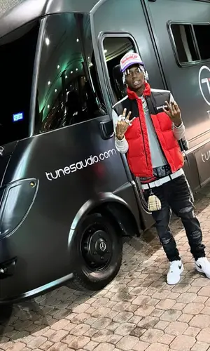 Soulja Boy wearing Burberry backpack