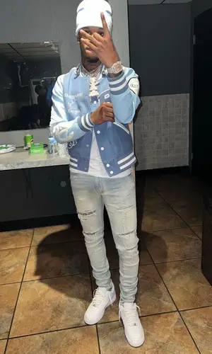 Toosii wearing Ruggero Clothing jacket