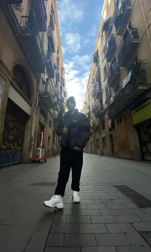 Rauw Alejandro wearing Supreme jacket