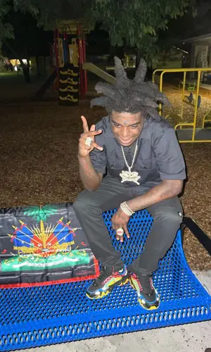 Kodak Black wearing Dickies shirt