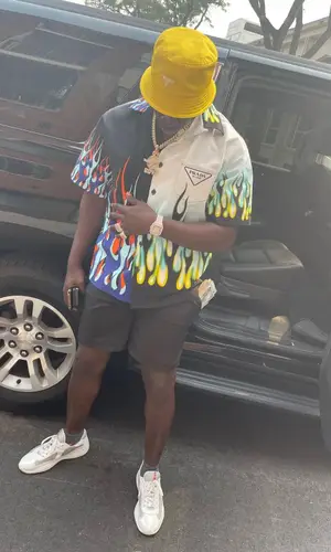 G4 Boyz Buggy wearing Prada shirt