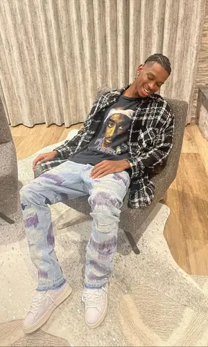Shai wearing Faith Connexion shirt