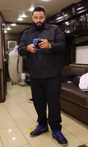 DJ Khaled wearing Dior trousers