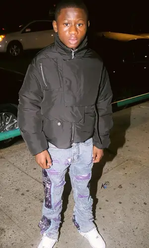 Bouba Savage’s Outfit in Who Decides War Jacket & Nike Sneakers (2021)