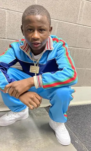 Bouba Savage wearing Gucci jacket