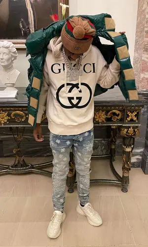 Lil Tjay wearing Gucci jacket