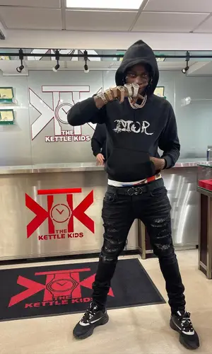 Russ Millions wearing Dior belt