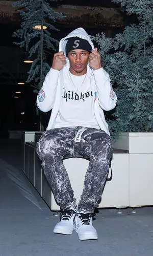 Mikey wearing Supreme hat