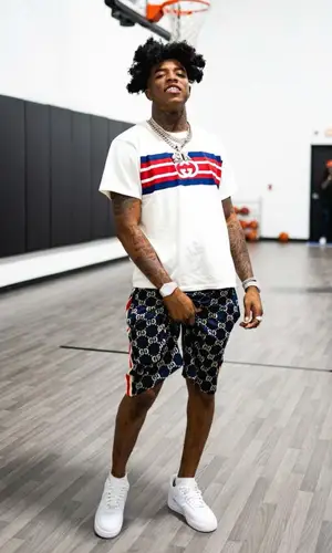 Yungeen Ace wearing Gucci shorts