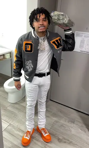 No Cap wearing Alexander McQueen sneakers