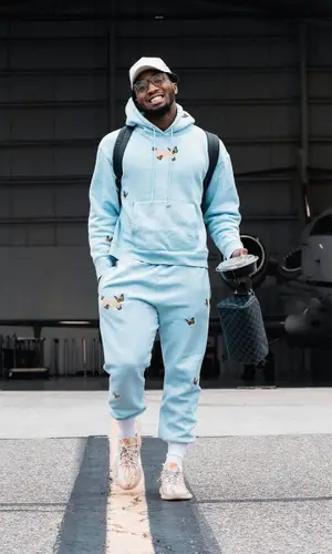 Donovan Mitchell’s Outfit in Felt Hoodie, Yeezy Sneakers & Louis Vuitton Bag (2021)