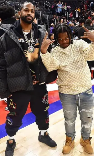 42 Dugg wearing Amiri jeans
