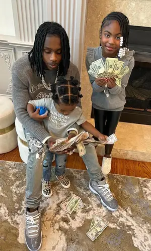 Polo G wearing Dior sweater