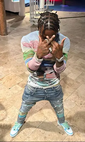 DaBaby wearing Amiri jeans