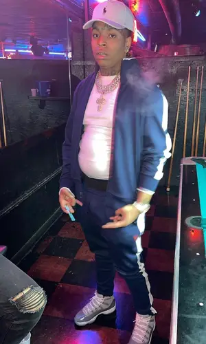 Lil Gotit wearing Polo Ralph Lauren jacket