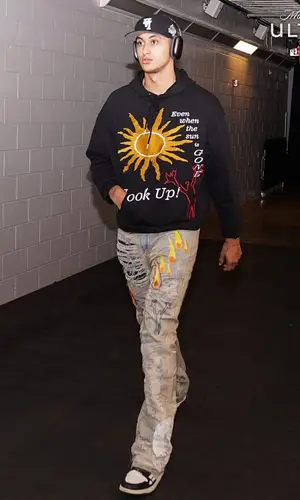 Kyle Kuzma wearing Who Decides War jeans