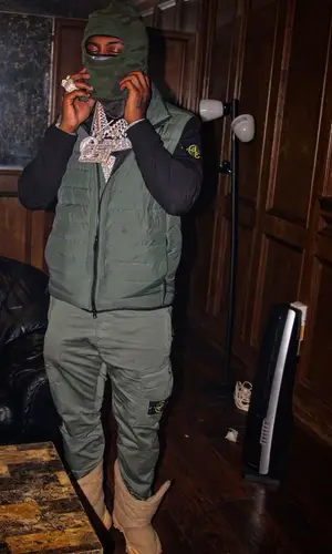 EST Gee wearing Stone Island pants