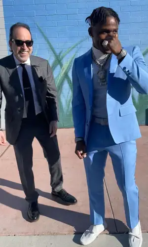 DaBaby wearing Louis Vuitton boots