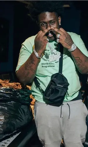 Sheff G wearing Balenciaga bag