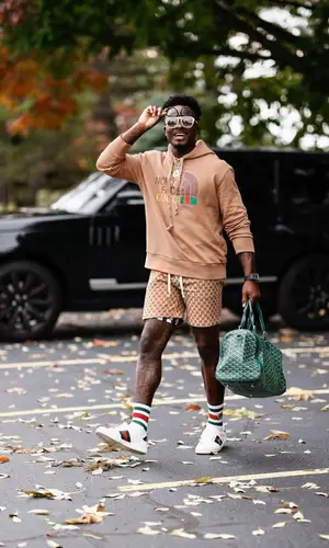 Marquise Goodwin wearing Gucci boots