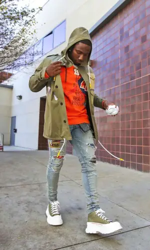 Deebo Samuel wearing Palm Angels jacket