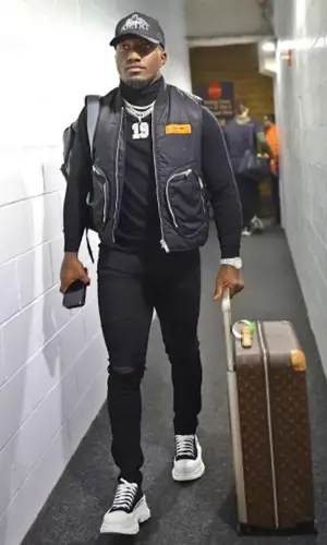 Deebo Samuel wearing Heron Preston jacket