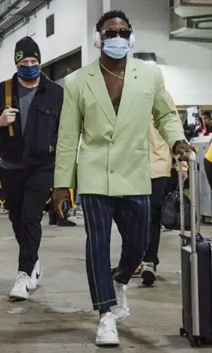 Ugo Amadi wearing Alexander McQueen sneakers
