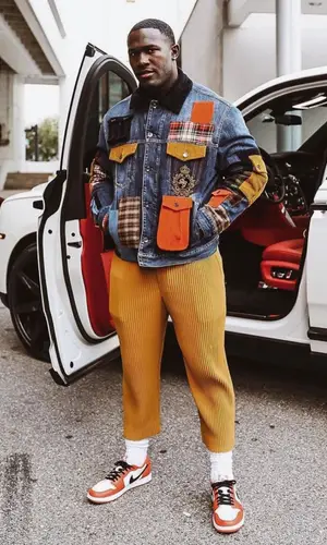 Devin White wearing Homme pants