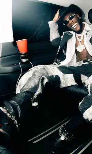 Burna Boy wearing Bottega Veneta belt