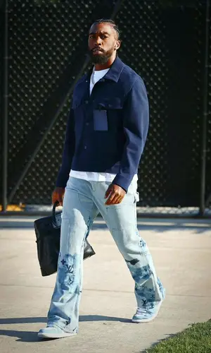 Tyrod Taylor wearing Louis Vuitton pants