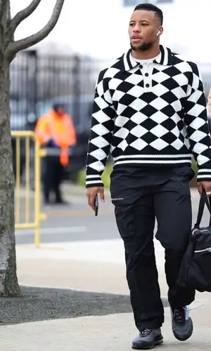 Saquon Barkley wearing Rhude sweater