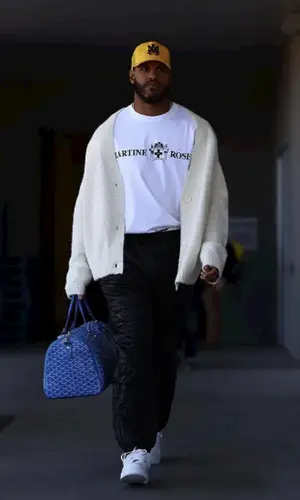 Anthony Barr wearing Louis Vuitton pants